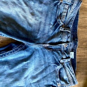 The brand is Warehouse wone, there stone washed jeans, there flared and low rise
